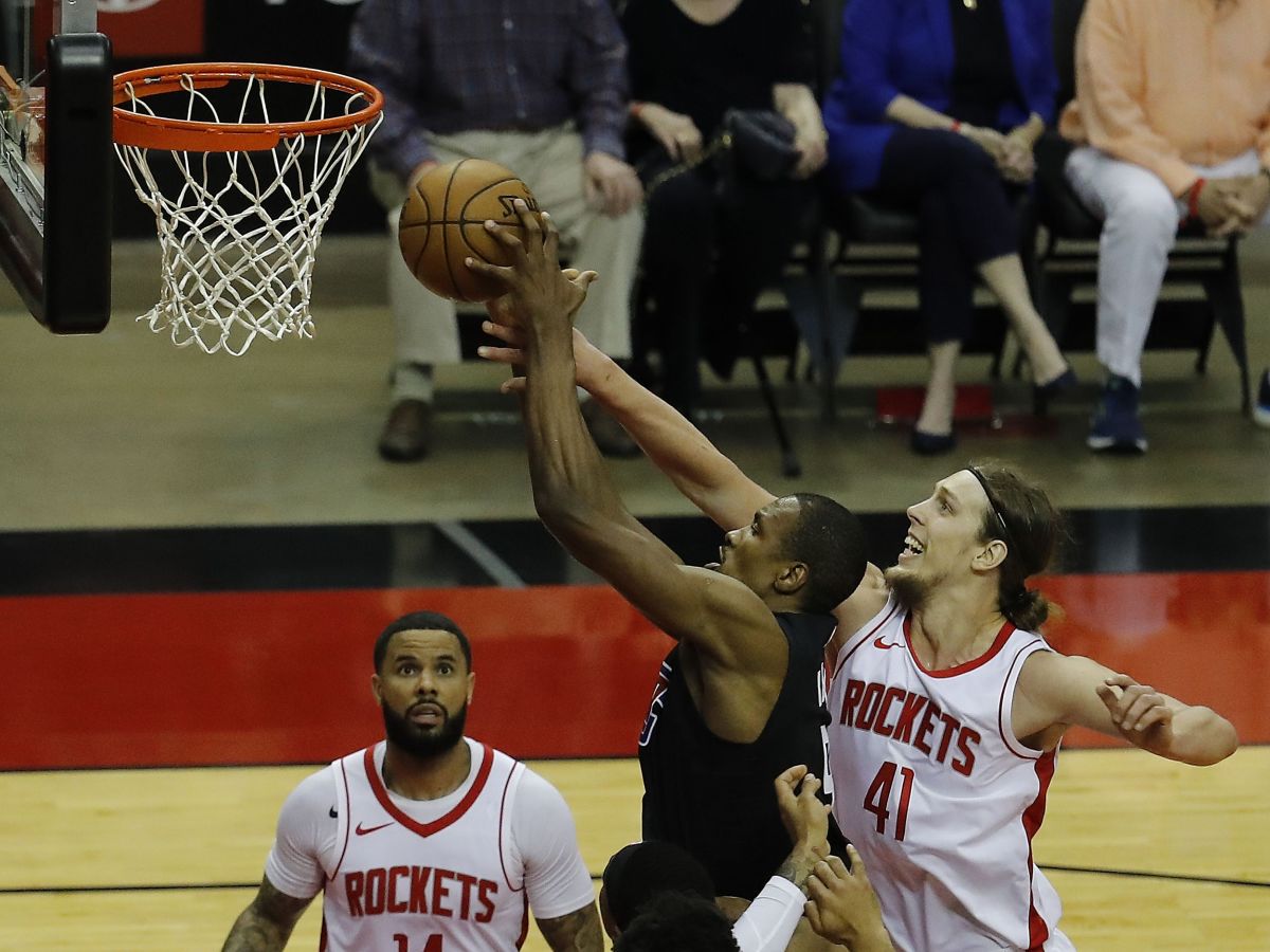 May 14, 2021; Houston, Texas, USA; LA Clippers center Serge Ibaka (9) drives to the basket as Houston Rockets forward Kelly Olynyk (41) defends during the first quarter at Toyota Center. Mandatory Credit: Bob Levey/Pool Photo-USA TODAY Sports